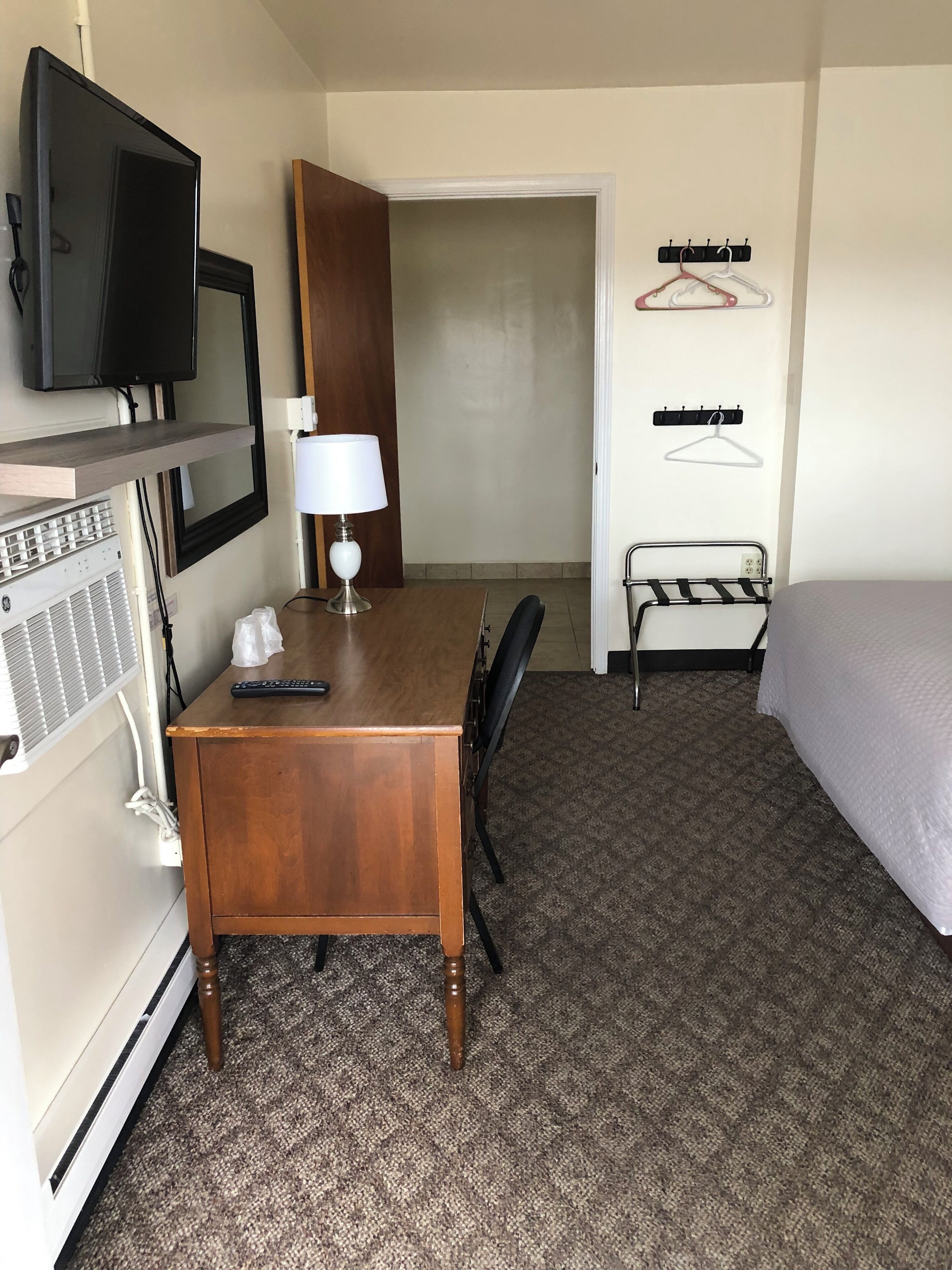 Desk, laptop workspace, blackout drapes, iron/ironing board