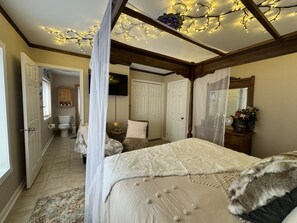 A bedroom with a canopy bed, a wooden ceiling, and string lights. - Romantic or Family Vacay w/ Stunning Mtn Views & Hot Tub near Crabtree Falls (Montebello)