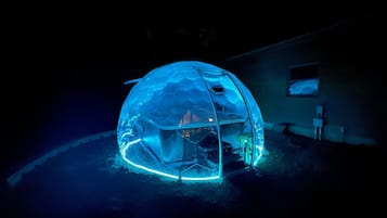 Experience the futuristic design of this dome-shaped retreat, featuring a bathtub and space.