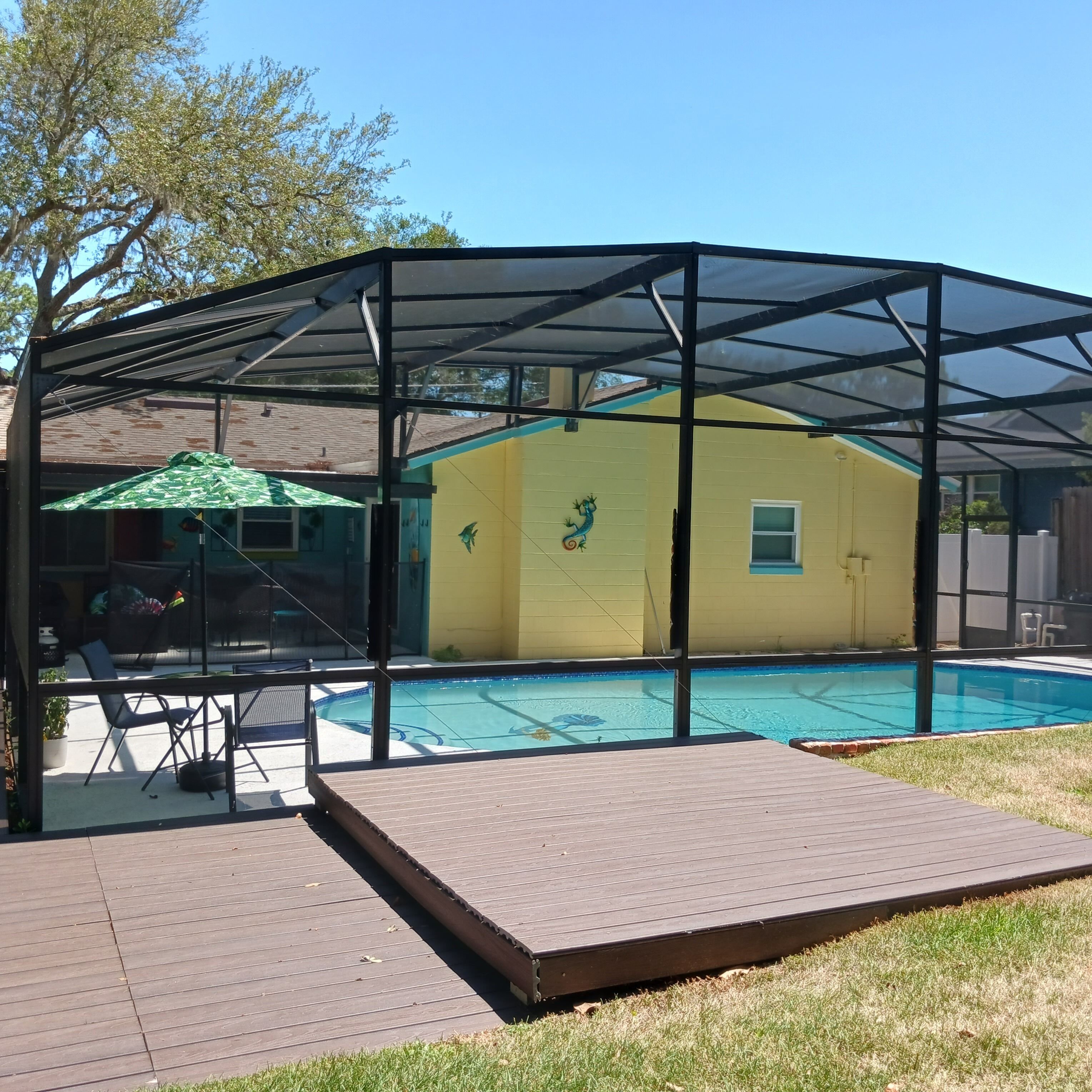 private screened swimming pool with sundeck
