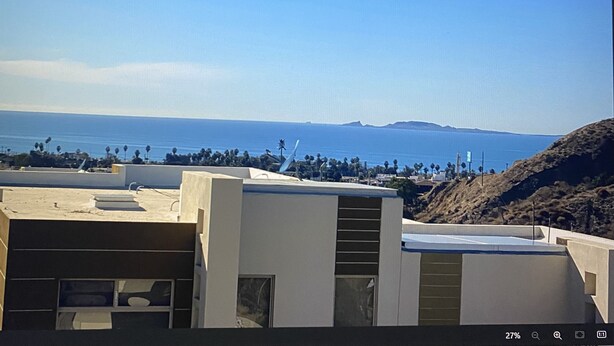 A coastal view with buildings and a clear sky. - Comfortable safe gated community, located 12 min away from Valle de Guadalupe. (El Sauzal)