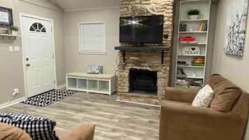 Smart TV, fireplace, books, music library