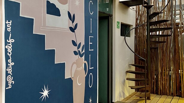 A building with a mural featuring a moon, stars, and a vase. The name "CASA" is prominently displayed. - Hotel downtown Cancun, great location! Private room. (Cancún)
