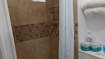 Shower, towels, soap, shampoo