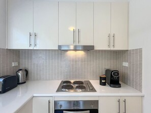 Fridge, microwave, oven, stovetop - Ground floor one bedroom apartment in Elsternwick (Elsternwick)