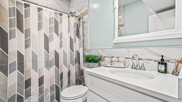 Shower, hair dryer, towels, soap