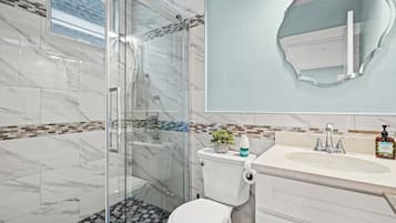 Shower, hair dryer, towels, soap