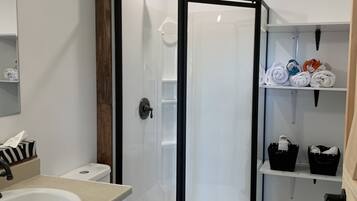 Shower, hair dryer, towels, soap