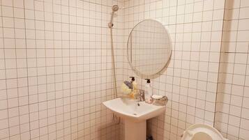 Economy Double Room | Bathroom | Shower, hair dryer, slippers, towels
