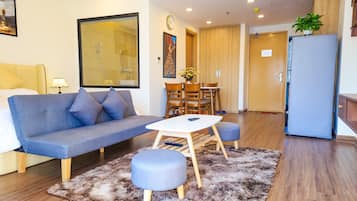 1 King Bed Studio with Sofabed | Living area | TV
