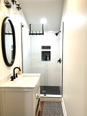 Shower, hair dryer, towels, soap