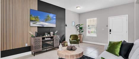 Smart TV, fireplace, books, offices