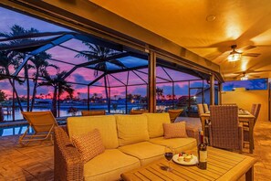Outdoor dining - Waterfront w/ south facing pool, Beautiful view, Gulf Access, Dock, Kayaks, Short drive to Beach! (Cape Coral)