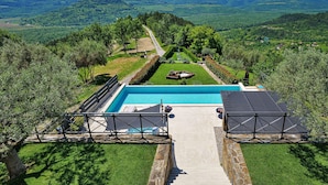 A pool with a clear view of the surrounding landscape, a pathway leading to the pool, and a small garden area. - Villa Over the Hilltop by Interhome (Motovun)