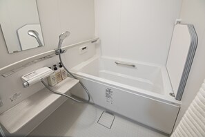 A modern bathroom with a bathtub, a handheld showerhead, a control panel, and a mirror. - Mokunohana 2min to Station 2LDK 8ppl NEW (Osaka)