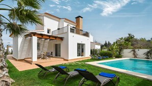A modern two-story house with a swimming pool, outdoor seating, and a well-maintained lawn. - Limoncello - Denia, Costa Blanca (Denia)