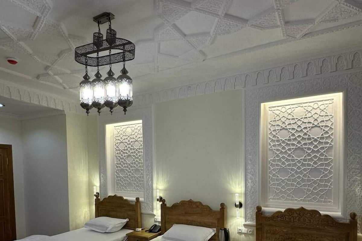 Chambre triple classique | Aire de séjour | Planchers chauffants