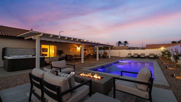 A backyard with a pool, outdoor seating, and a hot tub. - Montego by AvantStay | Private Yard w/ Pool & Hot Tub (Indio)