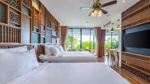 A hotel room with two beds, a ceiling fan, a TV, and a balcony with a view of greenery. - Bonny Boutique Hotel Da Nang (Da Nang)