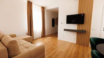 Deluxe Apartment | Living area | 108-cm Smart TV with digital channels