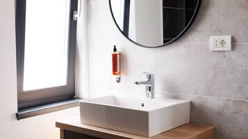 Deluxe Apartment | Bathroom | Shower, rainfall showerhead, hair dryer, bathrobes