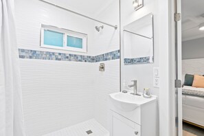 Shower, eco-friendly toiletries, hair dryer, towels