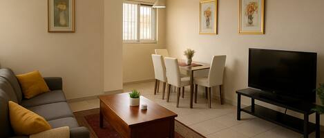 Apartment, 2 Bedrooms, Pool Access | Living area | 32-inch flat-screen TV with digital channels