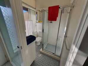 Economy Studio, Multiple Beds, Kitchenette, Poolside | Bathroom | Shower, towels, soap, shampoo