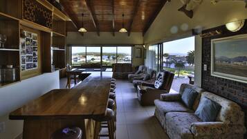 Comfort House | Living area | 42-inch flat-screen TV with satellite channels