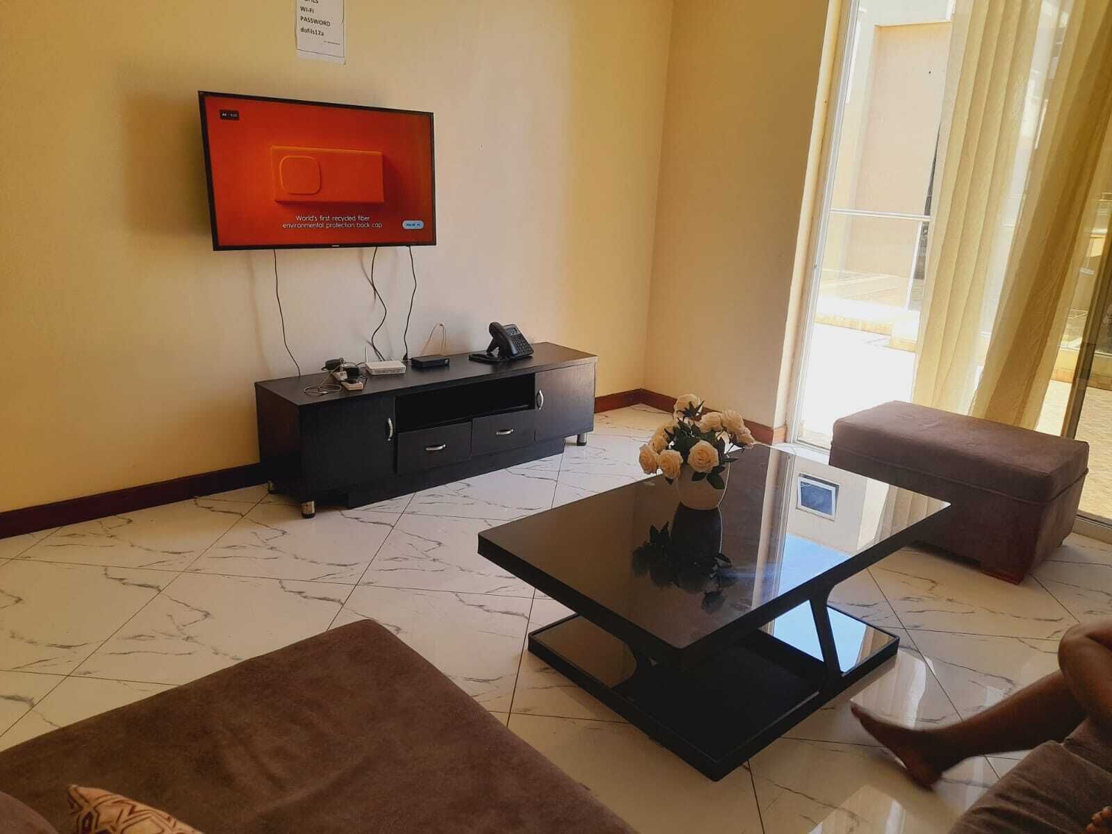 Deluxe Apartment | Living area | 24-inch Smart TV with digital channels