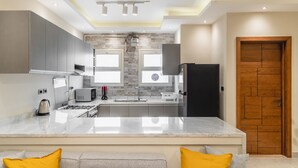 Basic Apartment | Private kitchen | Fridge, microwave, oven, stovetop - BIRD NEST Near AUC (New Cairo)
