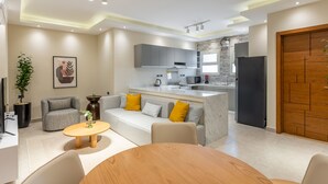 Basic Apartment | Living area | 43-inch LCD TV with satellite channels - BIRD NEST Near AUC (New Cairo)