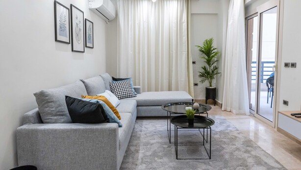Classic Apartment, 3 Bedrooms | Living area | 43-inch LCD TV with satellite channels - BIRD NEST Near AUC (New Cairo)