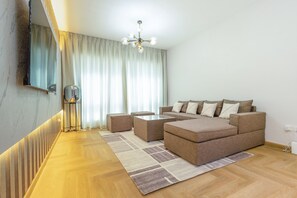 Elite Apartment | Living area | 50-inch Smart TV with cable channels - SuperHost - Tranquil Oasis in the Heart of Dubai Lakepoint N2 (Dubai)