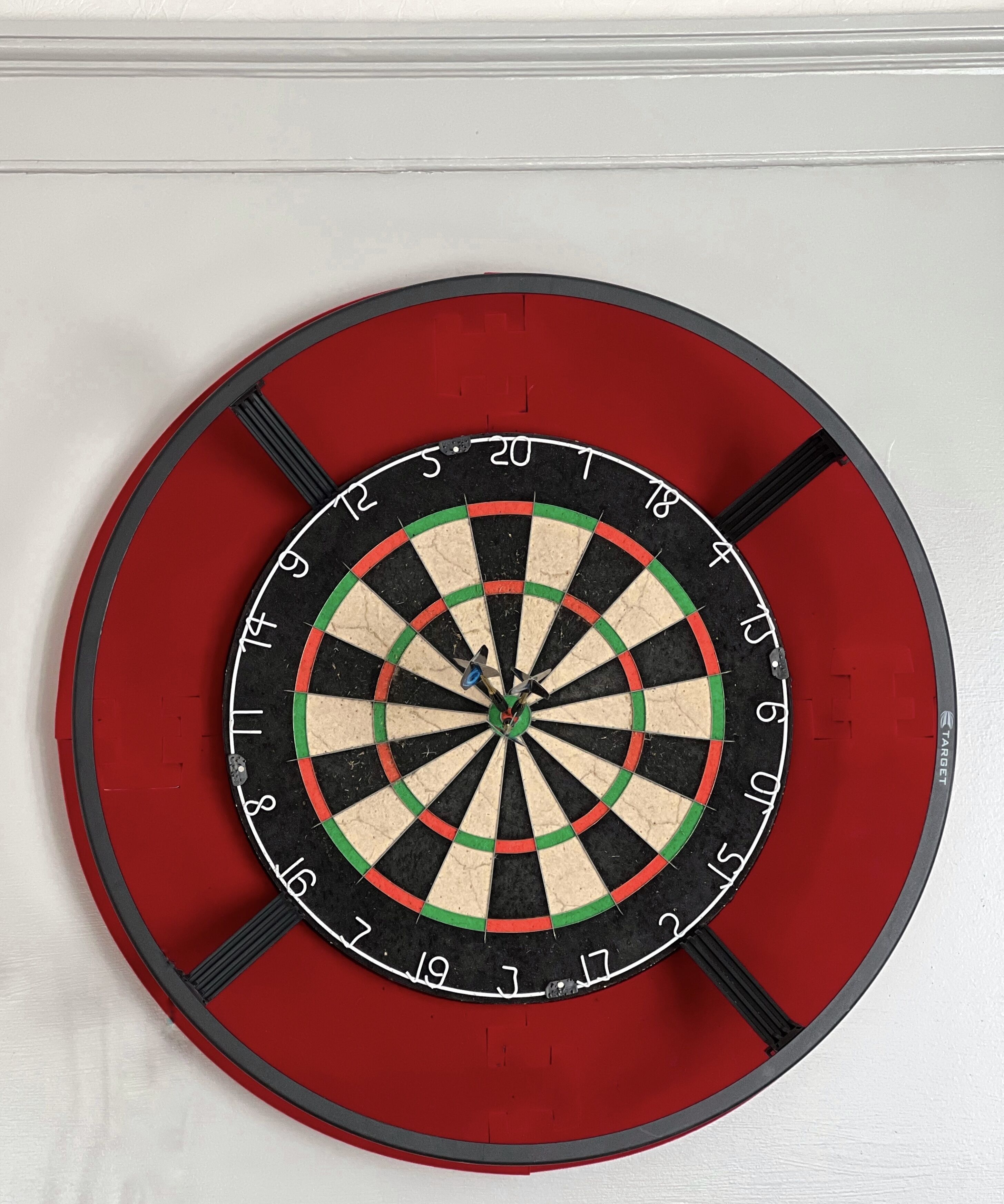 A dartboard mounted on a wall.