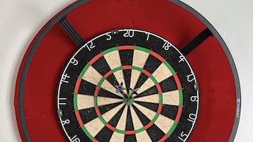 A dartboard mounted on a wall.