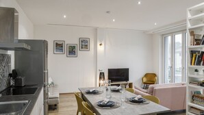 A modern living space with a kitchen, dining area, and seating area. - Fuori Le Mura - Balcony & A/C (Como)