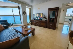 Luxury Apartment | Living area | 65-inch Smart TV with digital channels, Netflix, streaming services