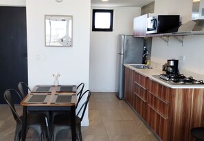 Fridge, microwave, stovetop, coffee/tea maker