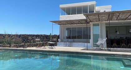 An architectural oasis with large swimming pool, along a breath-taking scenery.