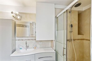 Shower, hair dryer, towels, soap