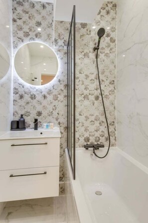 Shower, hair dryer, towels, soap