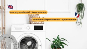 Un appartement moderne équipé d’un lave-linge à chargement frontal, d’un petit tabouret en bois sur lequel est posée une plante en pot, et d’un pouf en osier. Un espace dédié à la lessive est disponible dans l’appartement.