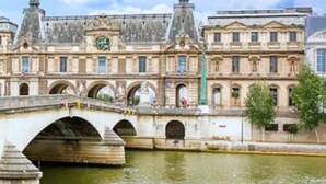 A historic building with a bridge over a river, featuring classical architecture and multiple arches. - 217 Suite Trocadero - Superb apartment in Paris (Paris 16 Passy)