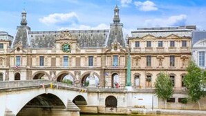 A historic building with a bridge over a river, featuring classical architecture and multiple arches. - 143 Suite La Française Superb Apartment in Paris (Paris 19 Buttes-Chaumont)