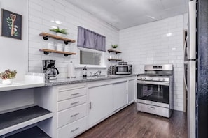 Microwave, toaster, cookware/dishes/utensils, spices