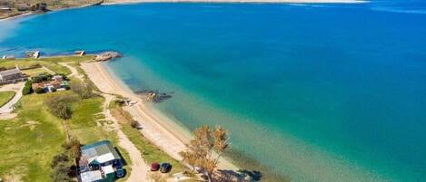 On the beach, sun-loungers