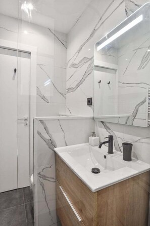 Shower, hair dryer, towels, soap
