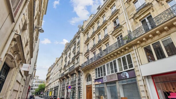 A narrow street lined with historic buildings, some with closed shutters, and a few parked motorcycles. - 620 Suite Martel - Superb apartment in Paris. (Paris 10 Entrepôt)