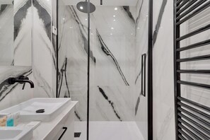 Shower, hair dryer, towels, soap
